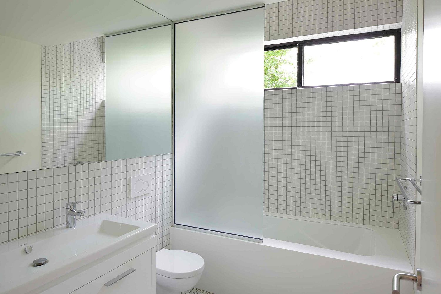 Contemporary bathroom in white tiled walls