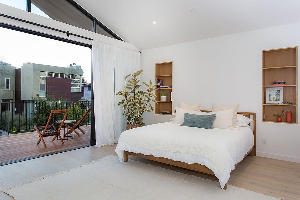 Contemporary-master-bedroom-in-white-with-large-balcony