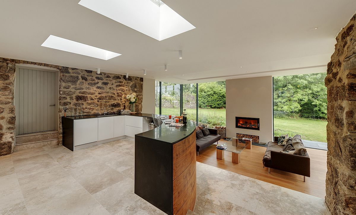 Contemporary sitting area and kitchen inside the refurbished historic home