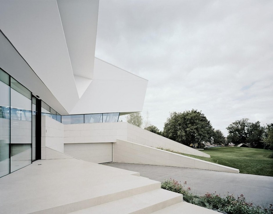 Contemporary white house with a gray driveway