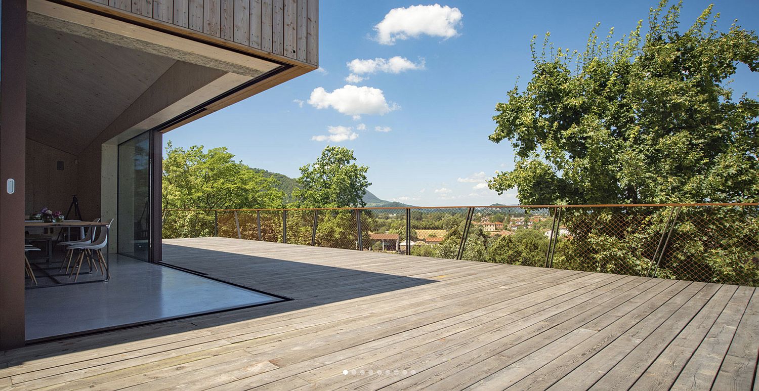 Corner of the B&B with sliding glass doors brings outdoors inside