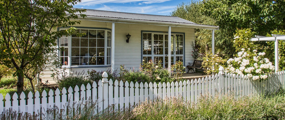 Countryside home with a white picket fence