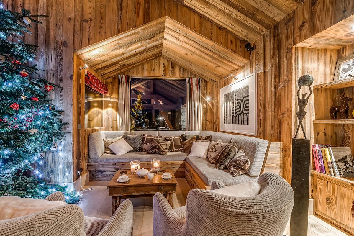 Cozy window seat in wood and stone inside the stunning luxury French chalet