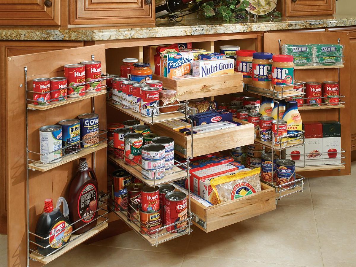 Custom shelves and sliding cabinets help create a fabulous and space-savvy pantry