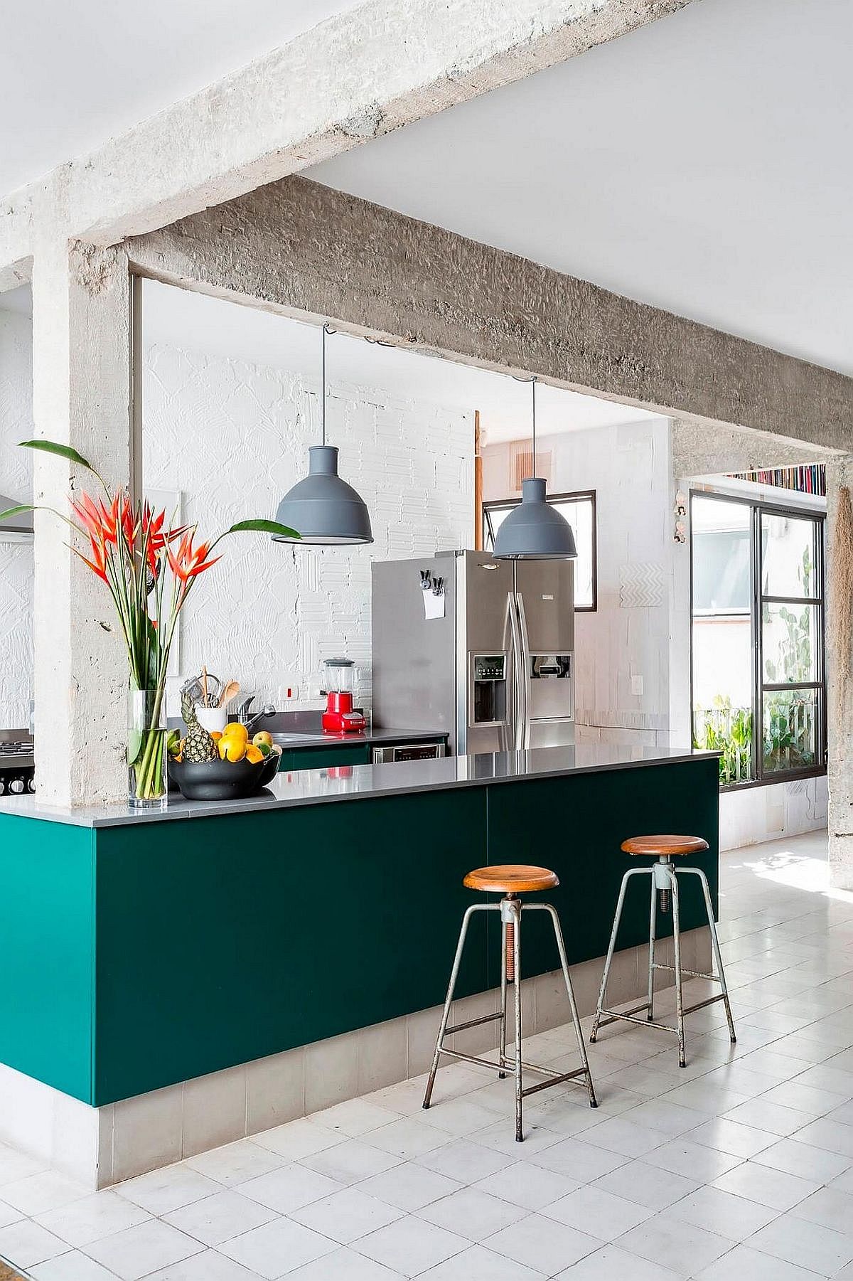 Exquisite kitchen island in Teal inside sophisticated Sao Paulo apartment