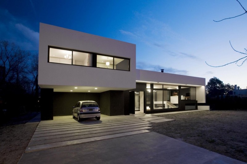 Gray concrete driveway for a modern monochrome house