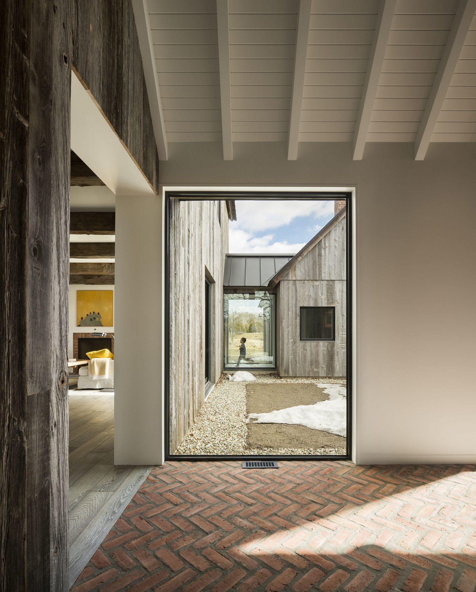 Herringbone pattern brick floor of the contemporary farmhouse