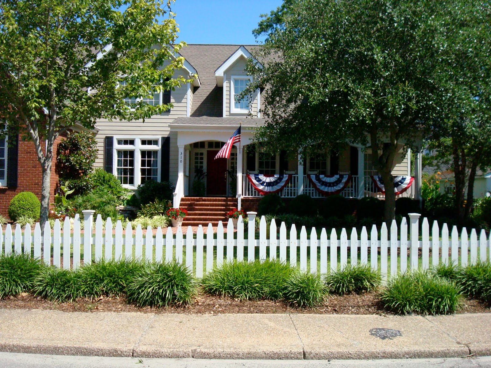 Home with a white picket fence and a A home with a conservative style