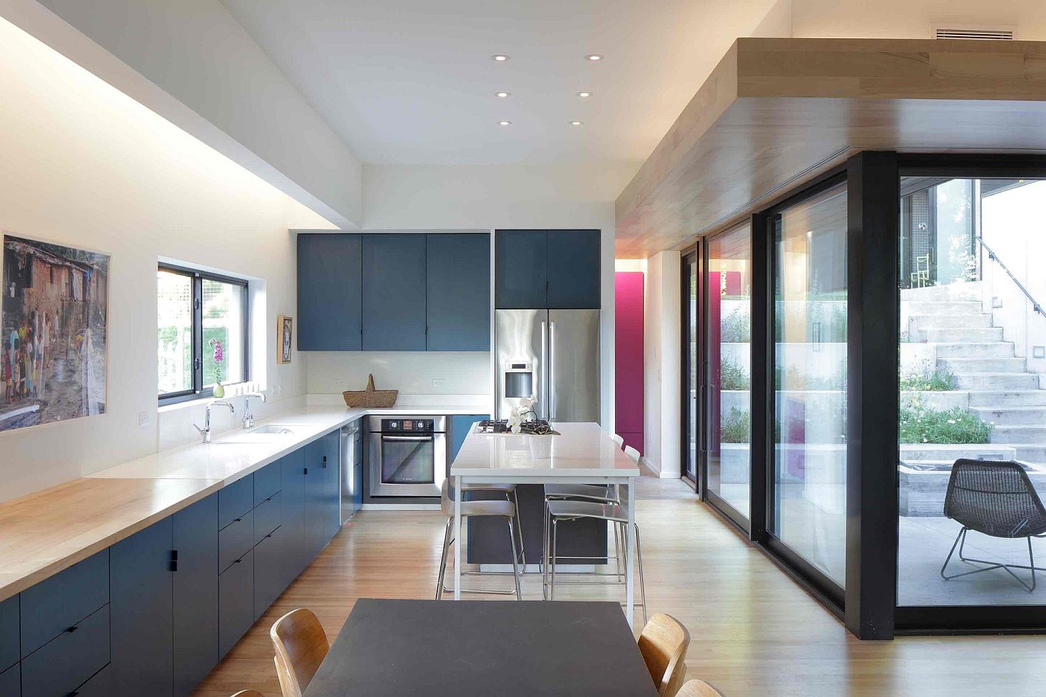 Kitchen in white and blue on the lower level