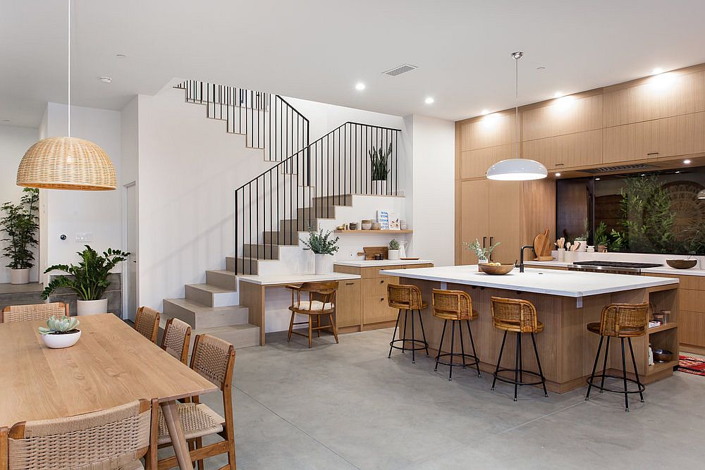 Kitchen in wood and white with home workspace next to it