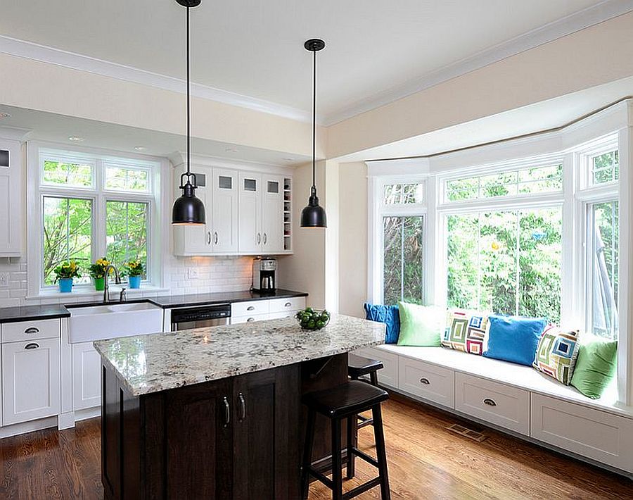 Make use of the kitchen nook with window seating that has built-in storage