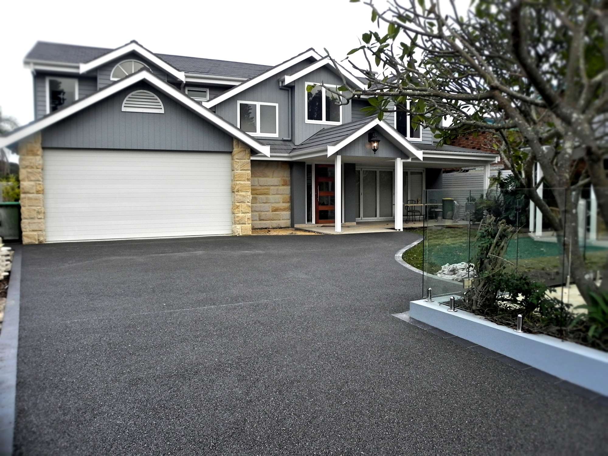 Modern gray house with a matching driveway