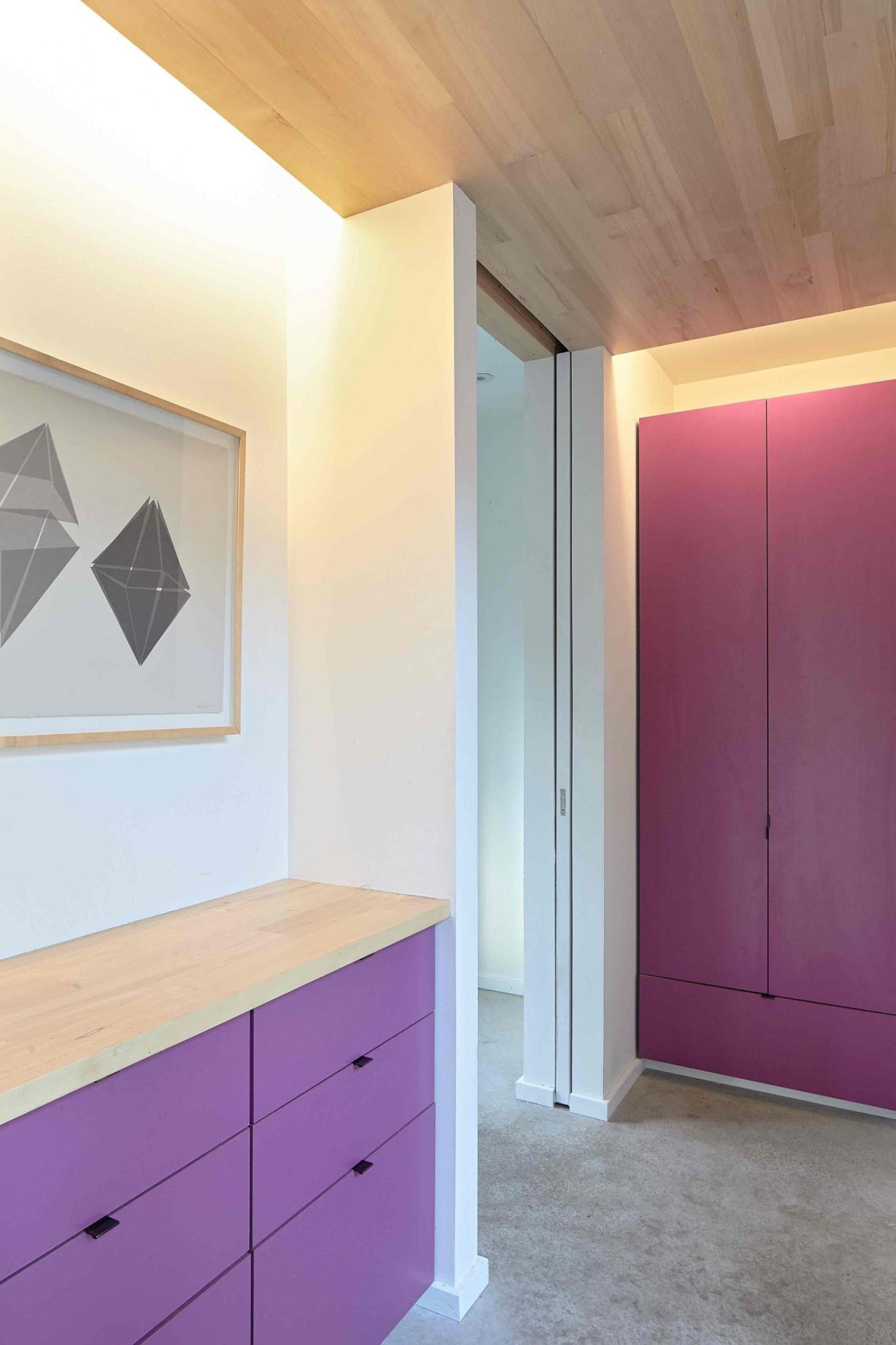 Purple brings color and brightness to the neutral interior