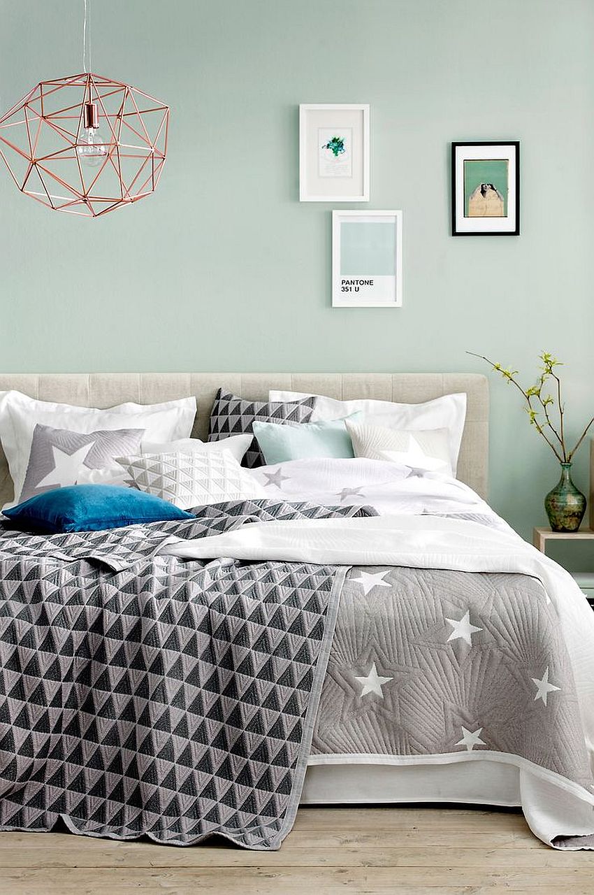 Refreshing mint blue coupled with gray and geo accents in this fashionable bedroom