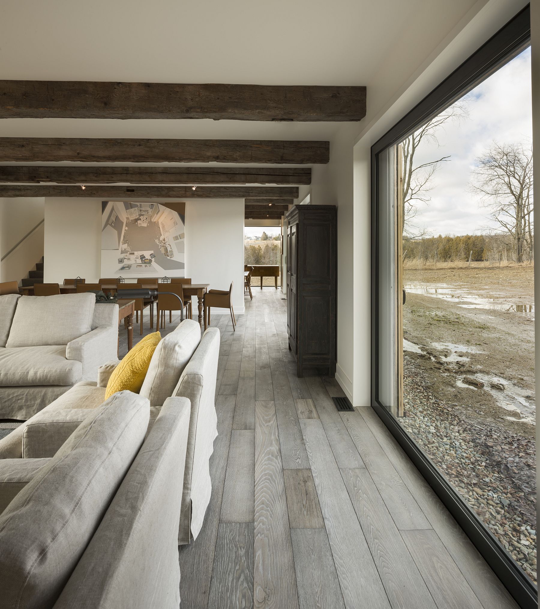 Rustic finishes are coupled with modern decor inside the North Hatley farmhouse