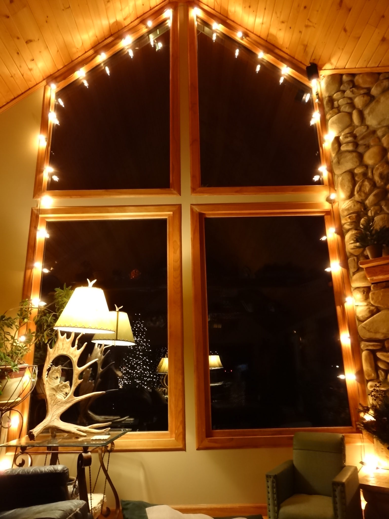 Rustic window decorated with string lights