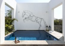 Sculptural-figure-of-a-horse-on-the-wall-next-to-the-Jacuzzi-217x155