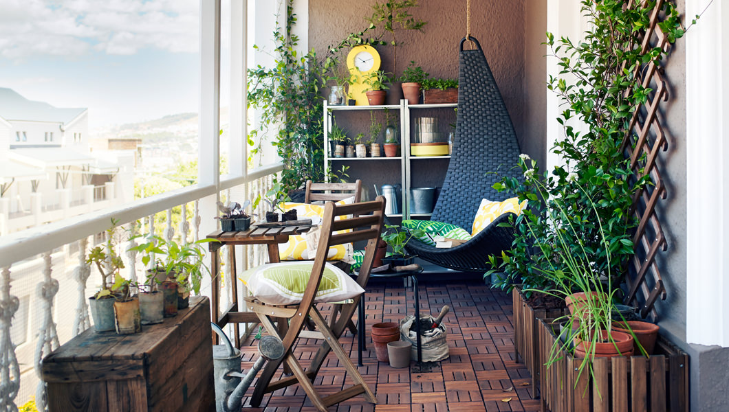 Small balcony with plants completely integrated in the space