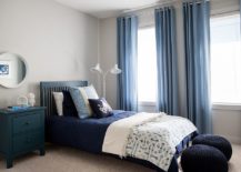 Small-beach-style-bedroom-with-gray-walls-and-beautiful-blue-drapes-217x155