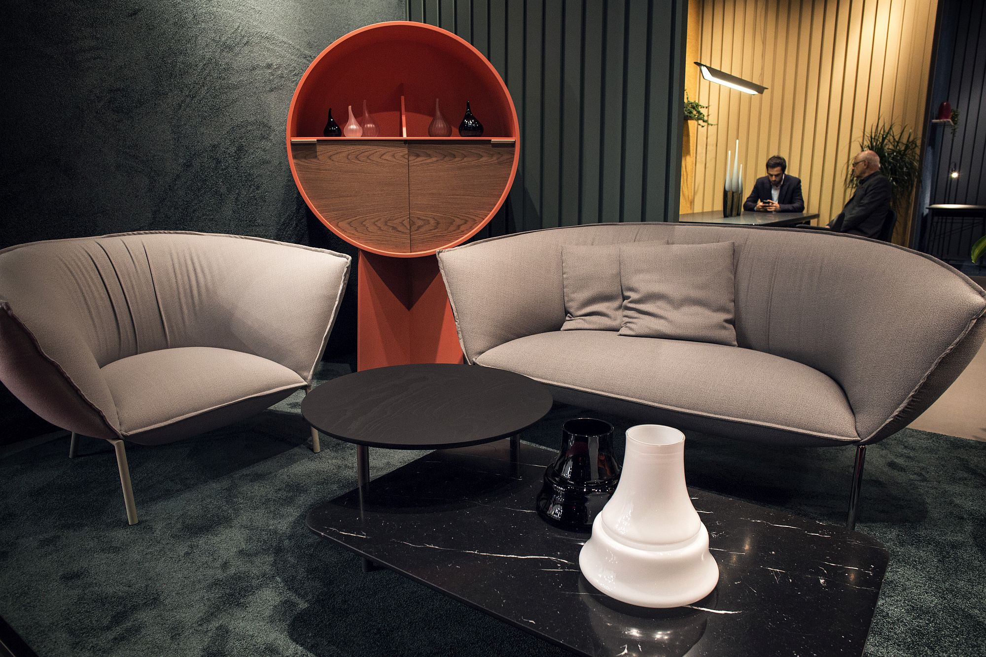 Small circular side table combine with low-slung coffee table in the living room