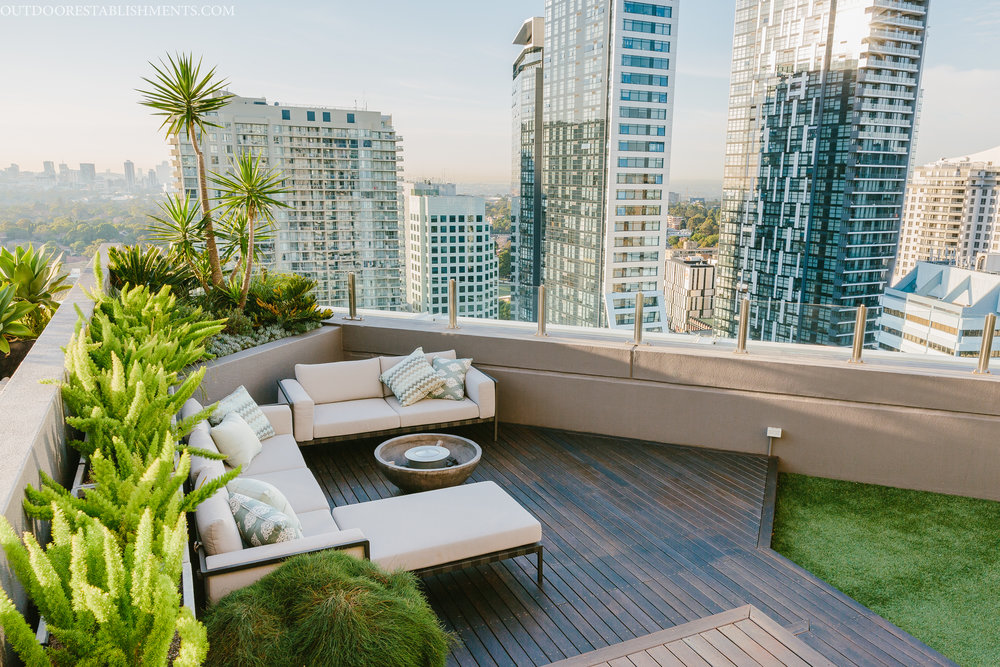 Soft beige decor makes the green balcony garden pop