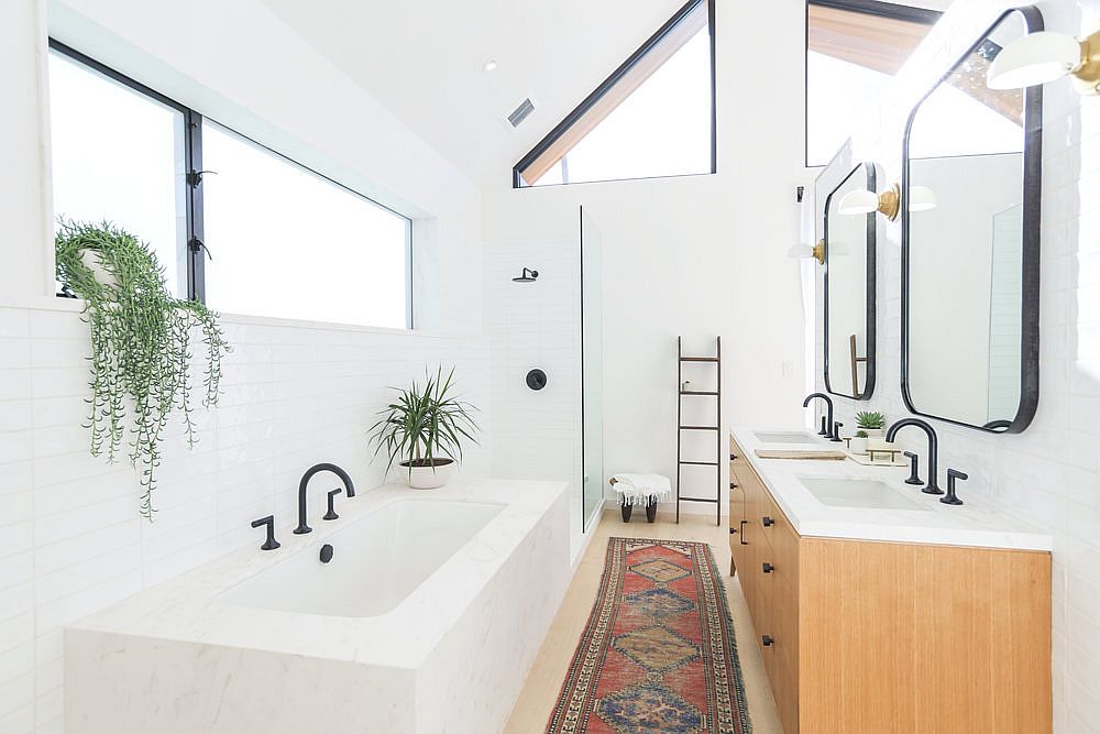 Spacious-bathroom-in-white-with-wooden-vanity-and-twin-sinks