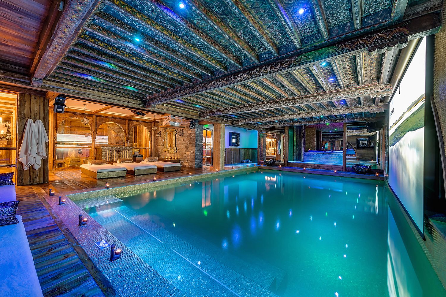 Spacious pool with warm jets is covered in gold leaf