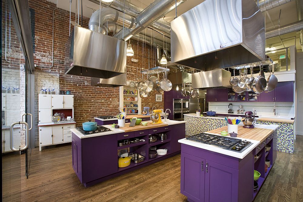 Stunning kitchen islands in purple bring dazzling color to the industrial space