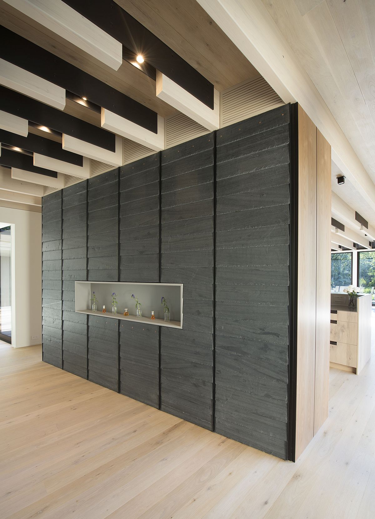 Textural contrast brought in by accent wall in the spacious home