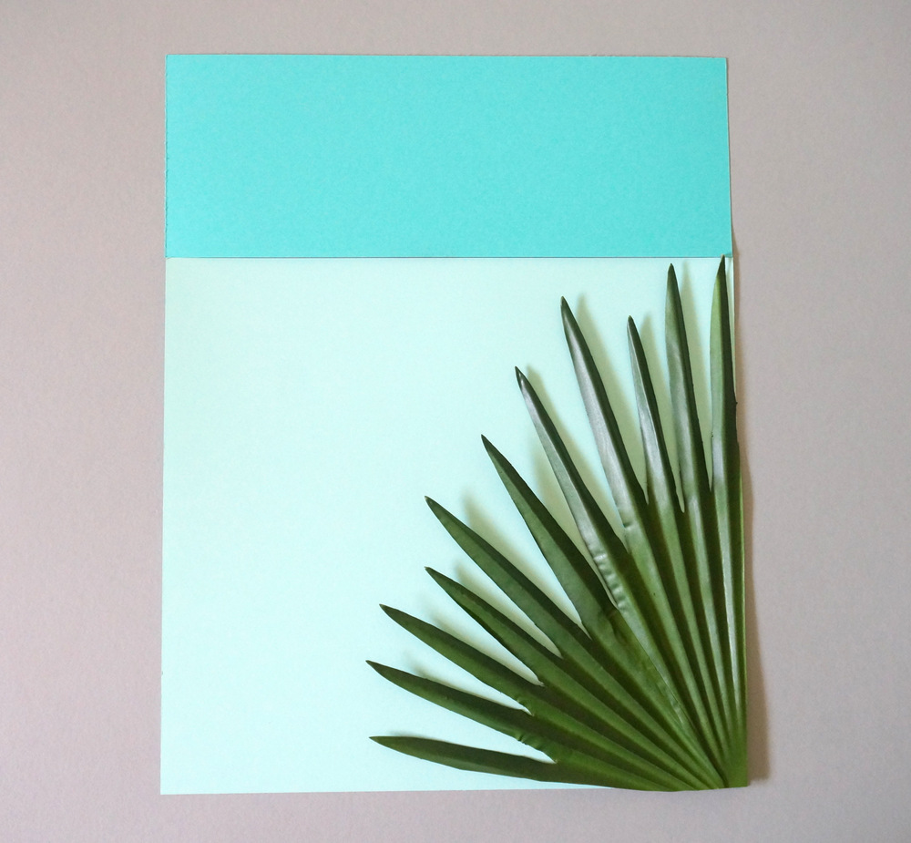 Try different arrangements of paper and palms