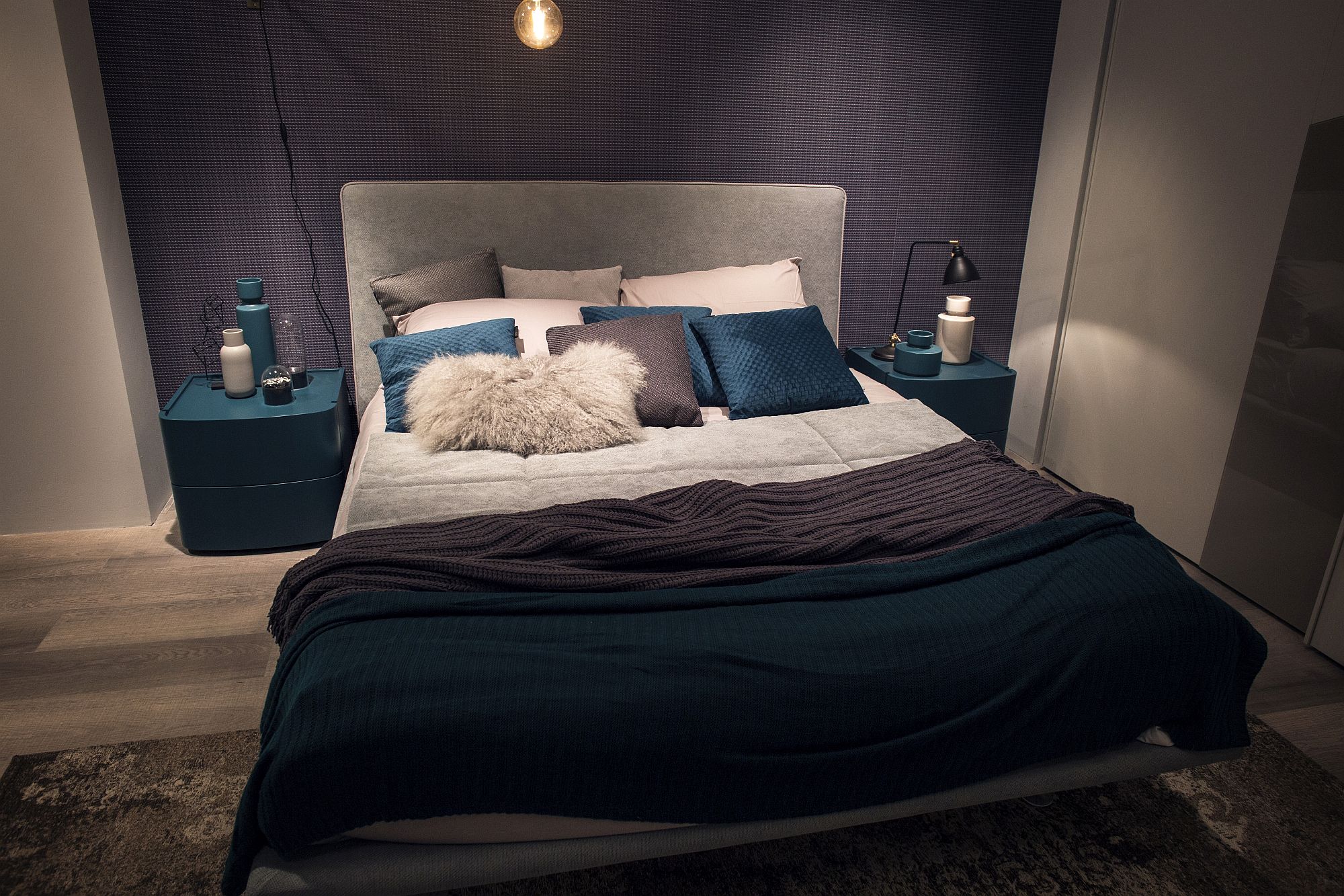 Twin nightstands add to the color scheme of the bedroom