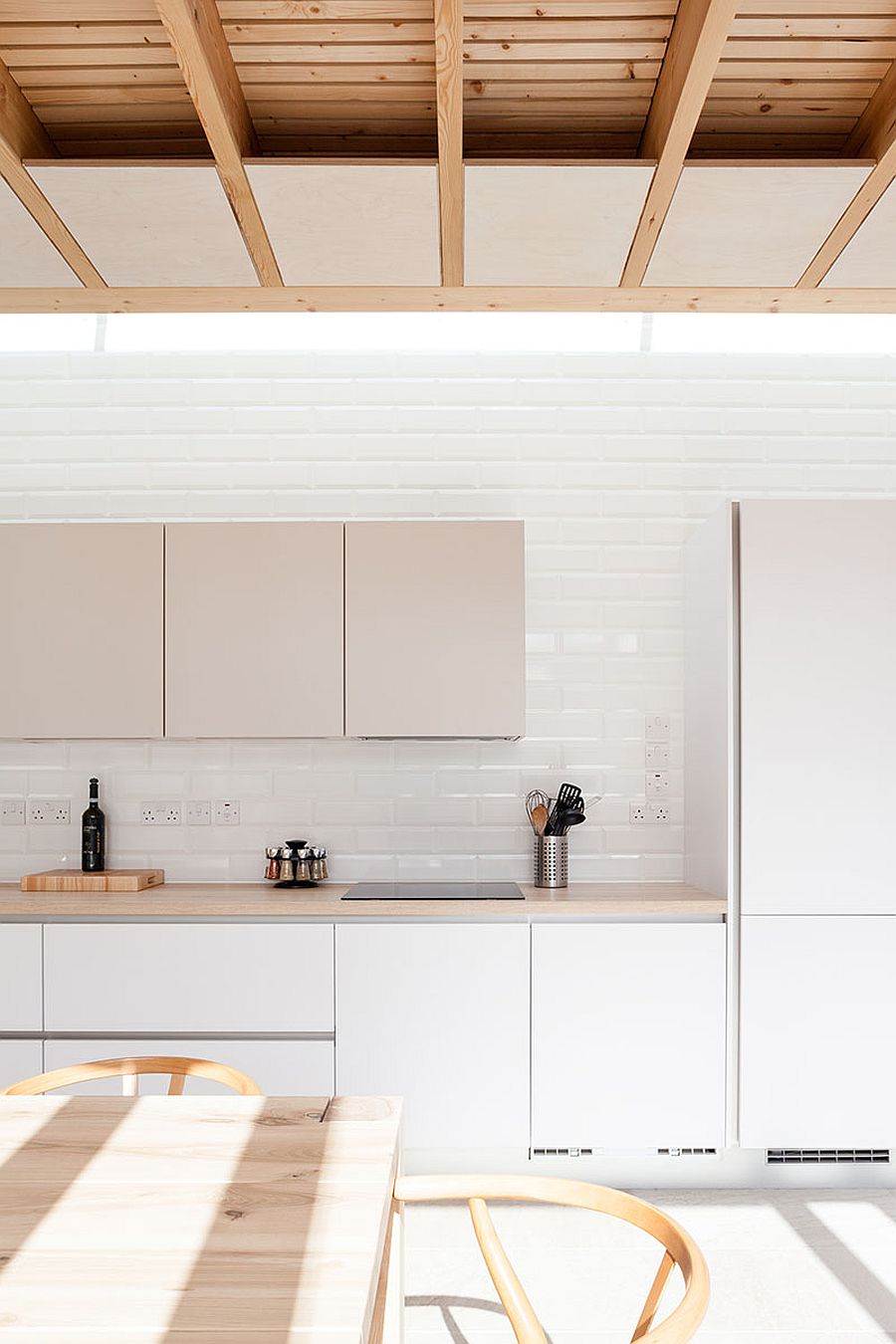 White kitchen and dining inside the contemporary extension of Dublin home