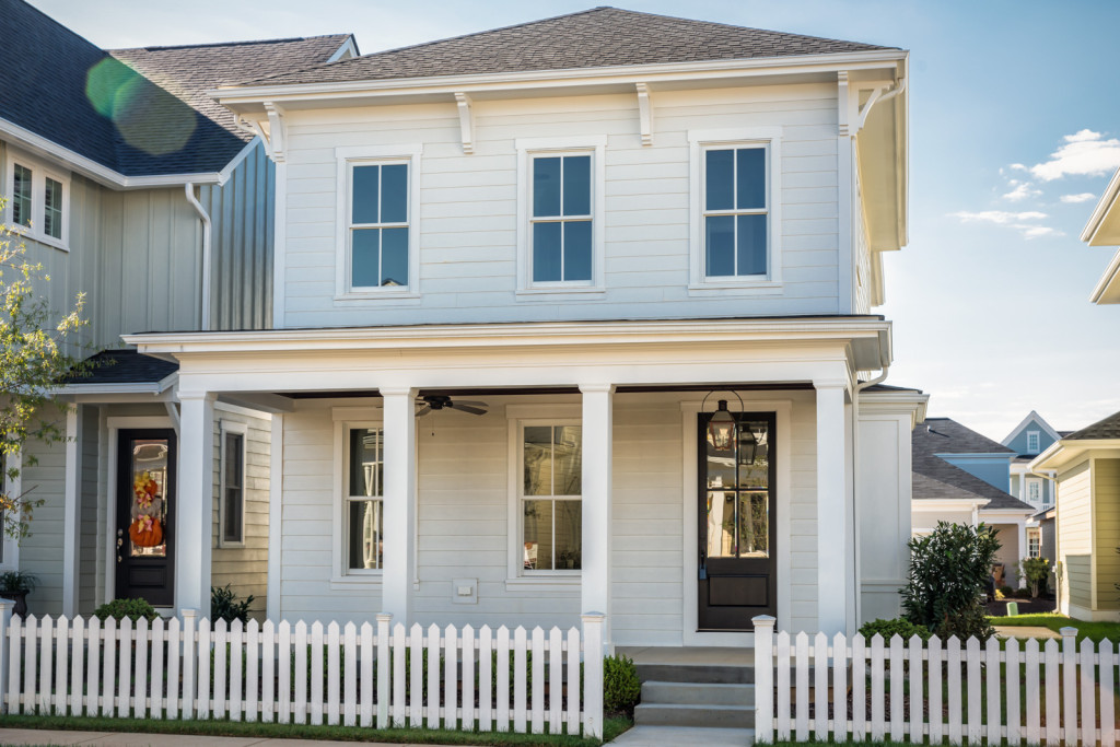 White picket fence matches the house