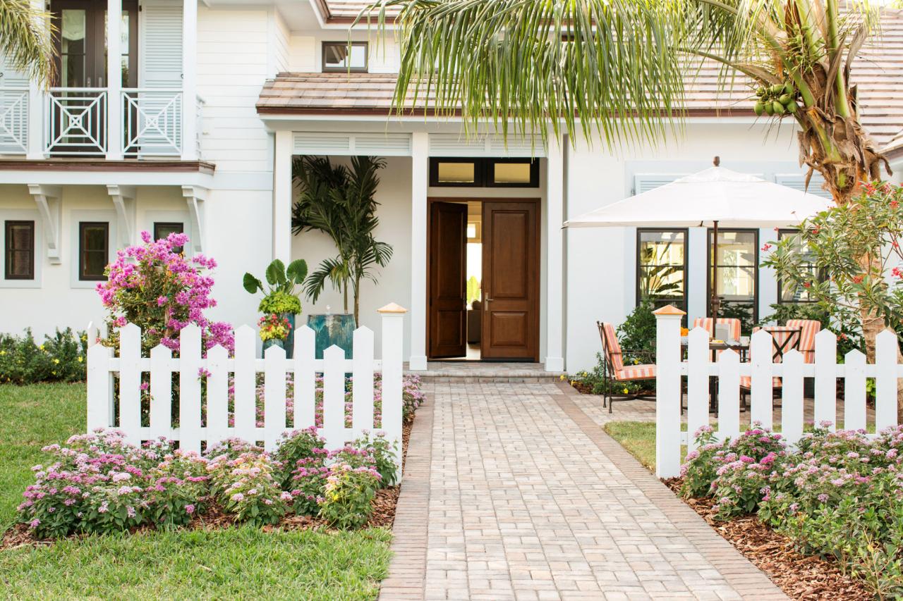 Wide white picket fence with a modern style