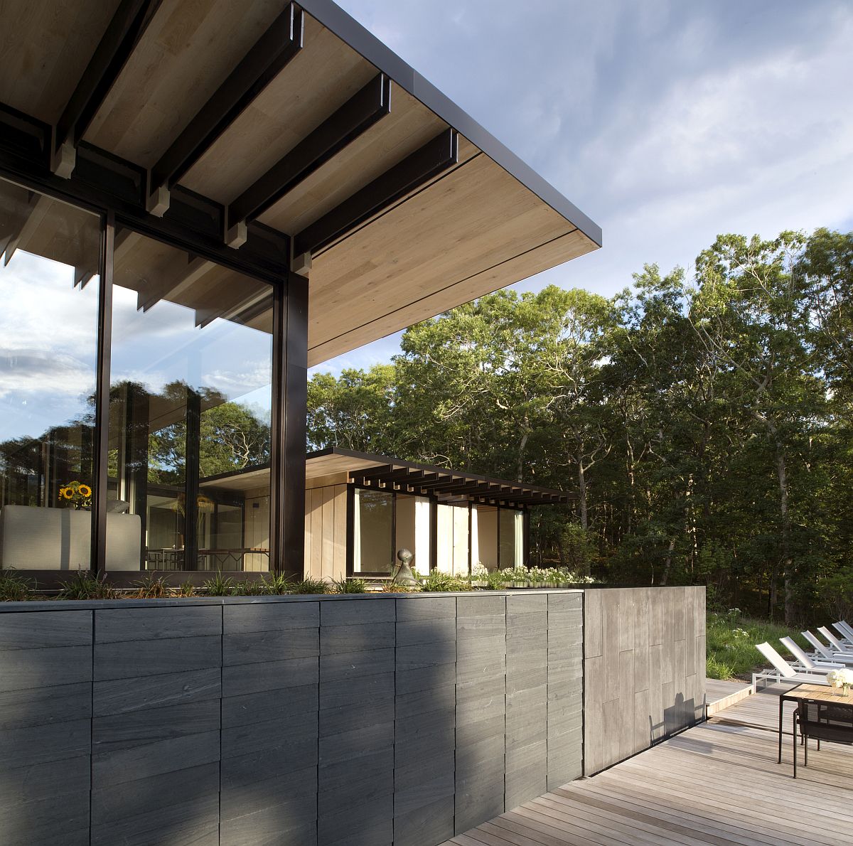 Wood along with steel flitch plates give the home a sturdy, open structure