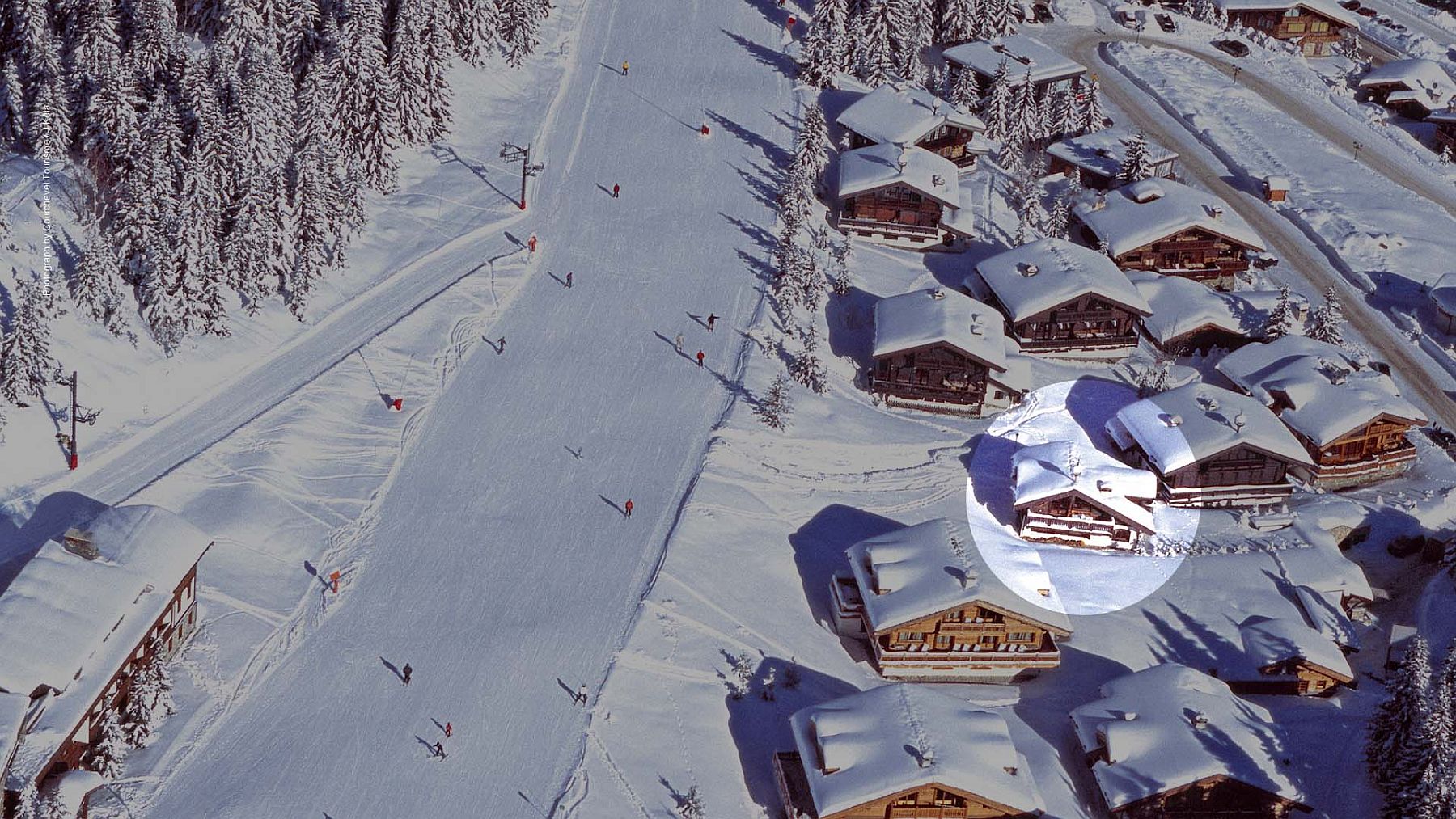 Aerial view of Chalet Le Namaste with ski slopes around it