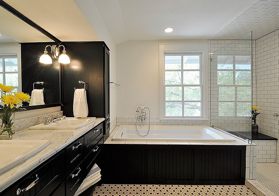 Bathtub, vanity and medicine cabinet in black present a picture of curated elegance in the bathroom