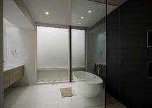 Black-and-white-minimal-bathroom-with-floating-wooden-vanity-217x155