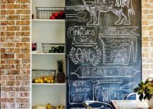 Chalkboard sliding wall next to brick walls creates a cool pantry 217x155 10 Unique Pantries that Usher Textural Beauty into Modern Kitchen
