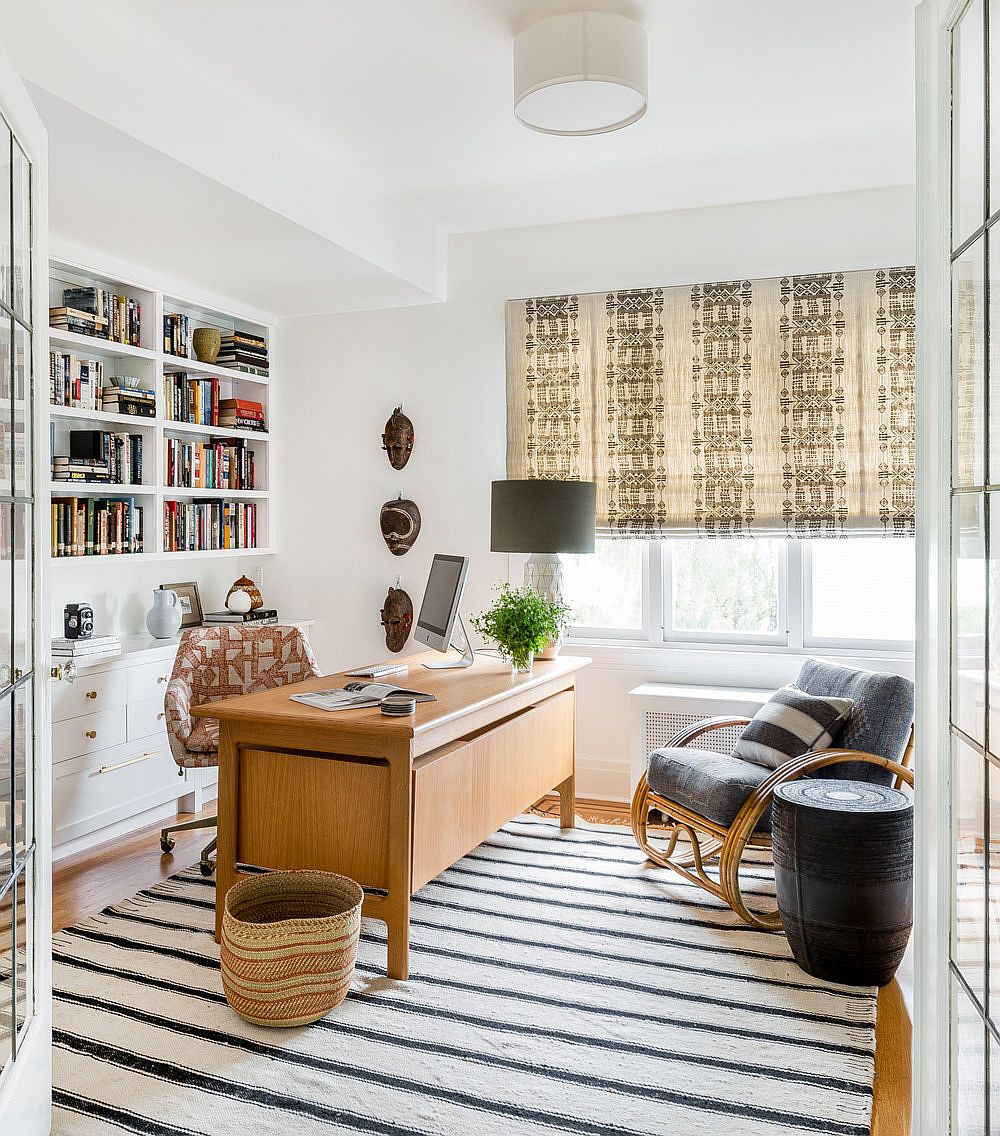 Cheerful and spacious home office in white with pops of blue