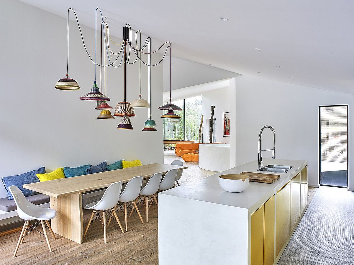 Colorful collection of pendants above the dining area