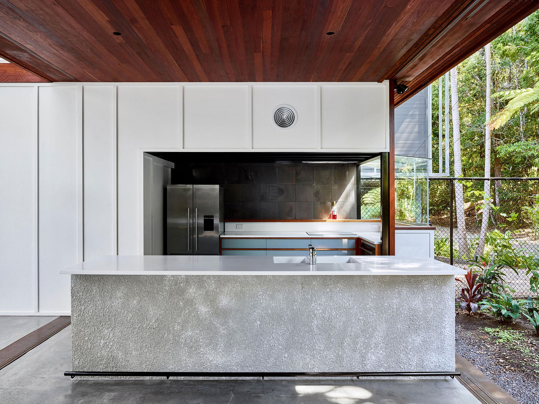 Concrete kitchen island is easy to maintain and clean