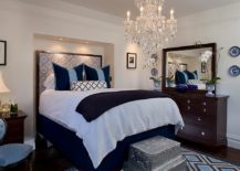 Contemporary-bedroom-in-white-and-blue-with-a-traditional-chandelier-217x155