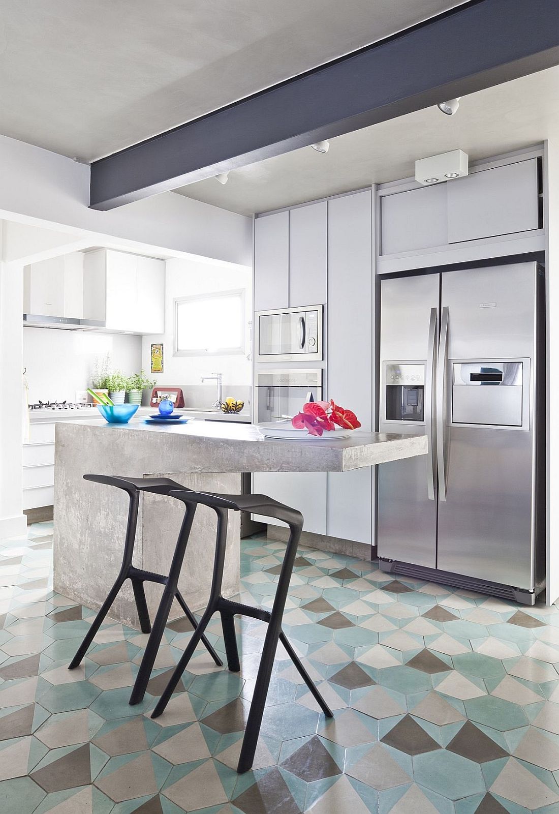 Contemporary kitchen with hexagonal floor tiles and a concrete island