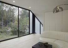Dark-framed-windows-bring-contrast-to-the-contemporary-interior-in-white-217x155