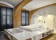 Exquisite-and-innovative-bed-design-with-built-in-bathtub-and-bookshelves-217x155