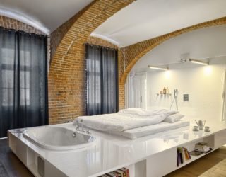 Modern Apartment of a Football Player Celebrates the Beauty of Brick Walls