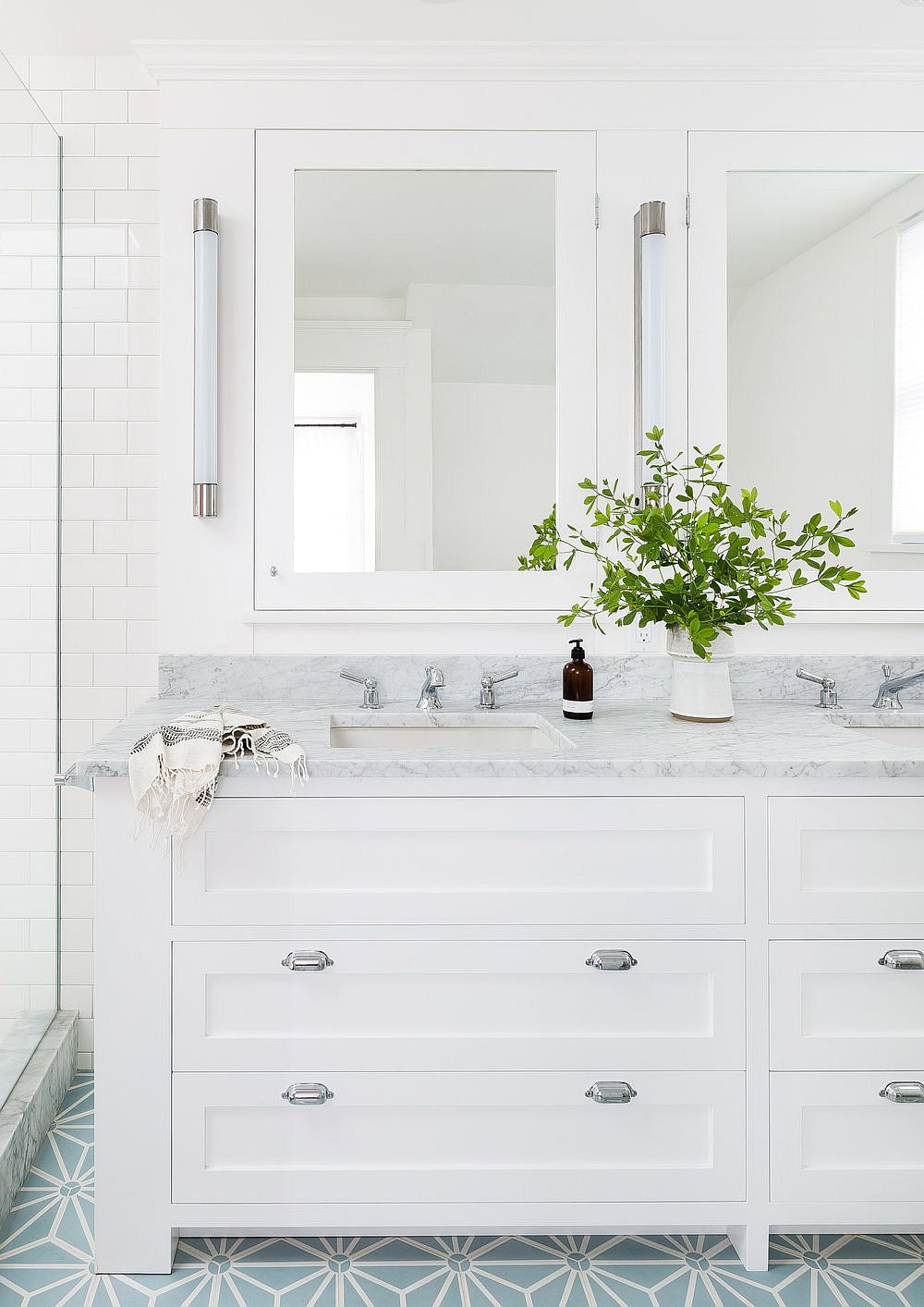 Floor tiles add pattern to the bathroom without altering the color scheme