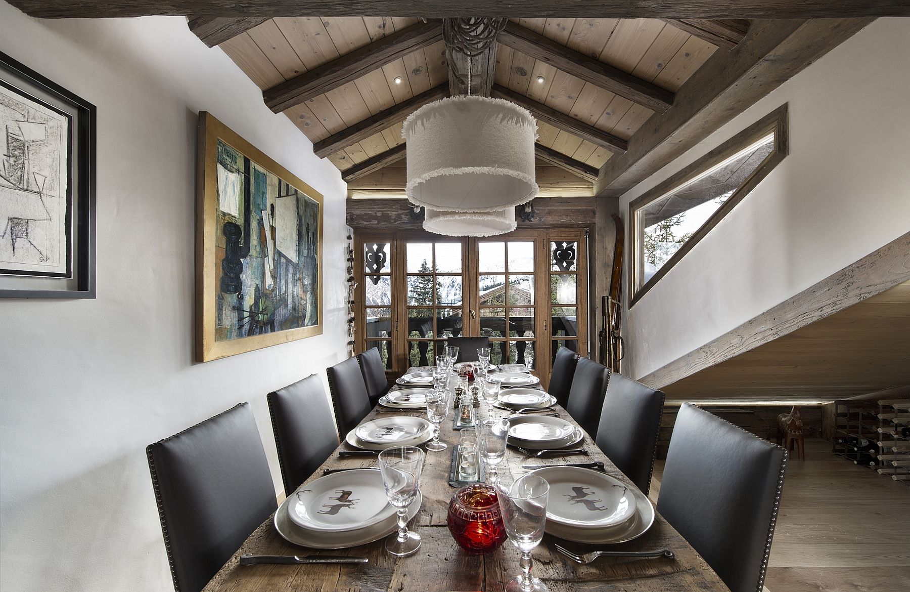 Formal dining room with majestic alpine views at luxurious Le Namaste