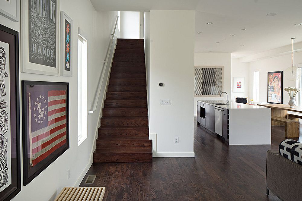 Framed flag and art work adds color to the neutral interior in white